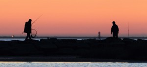 Two fishermen enjoy and evening on Galveston Bay.