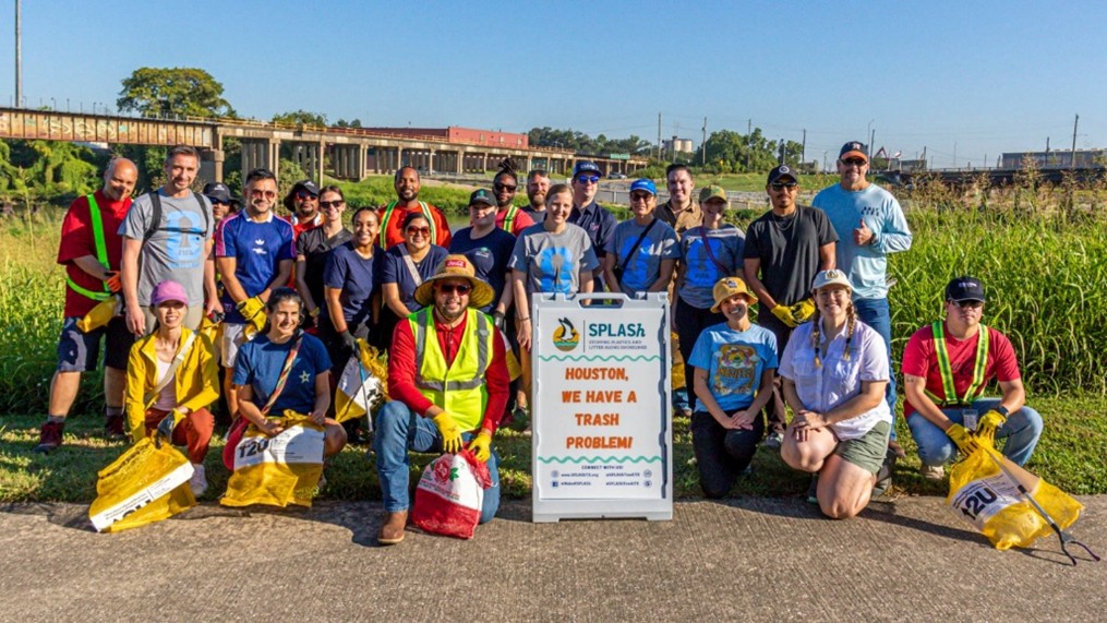 Volunteers attend the first Houston World Cup Sustainability Committee Cleanup at Brays Greenway Park to remove trash and debris from Houston waterways.